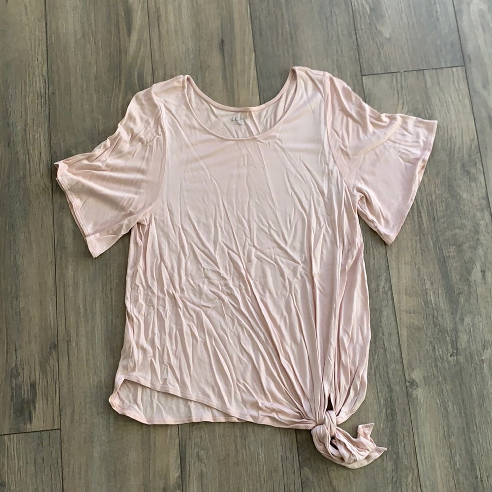 Soft and stretchy baby pink shirt with tie bottom